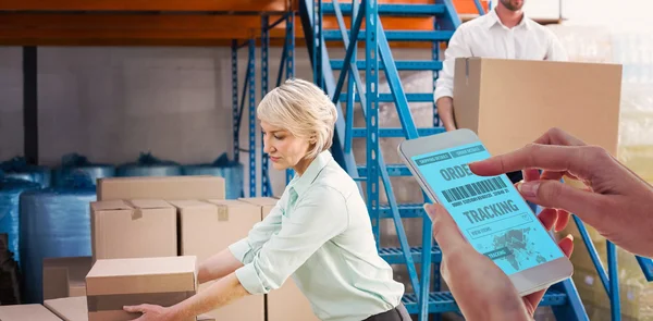 Warehouse managers loading trolley — Stock Photo, Image