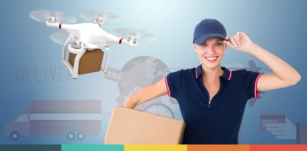 Delivery woman holding cardboard box — Stock Photo, Image