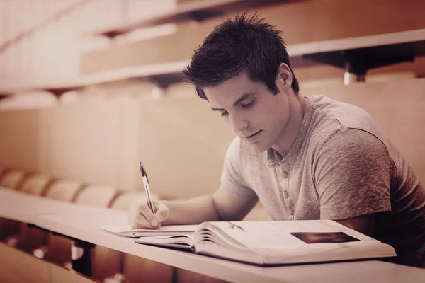 Student sitting taking notes — Stock Photo, Image