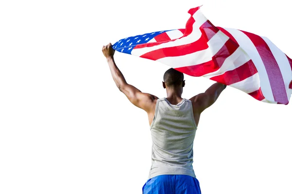 Atlético hombre sosteniendo bandera americana — Foto de Stock