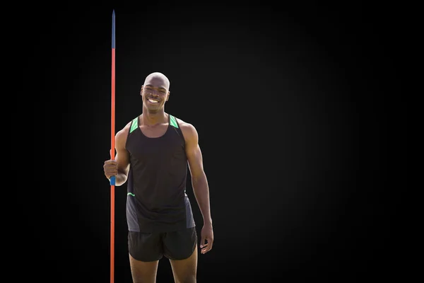 Happy sportsman is holding a javelin — Stock Photo, Image