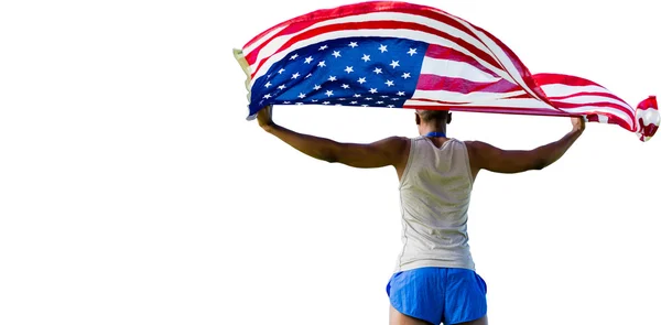 Deportista sosteniendo bandera americana — Foto de Stock