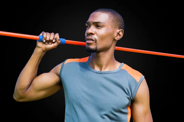 Athletic man preparing to throw javeline — Stock Photo, Image