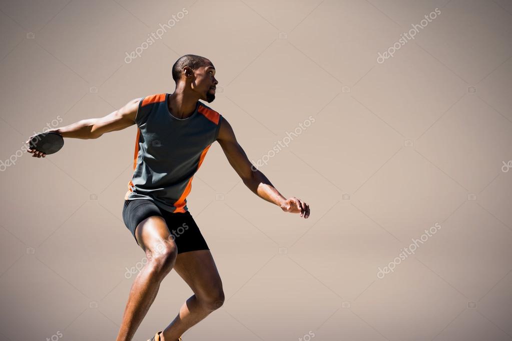 Athlete man throwing a discus Stock Photo by ©Wavebreakmedia 110705340