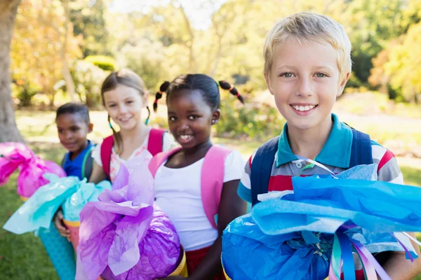 Kids posing with their gift surprise — Stock Photo, Image
