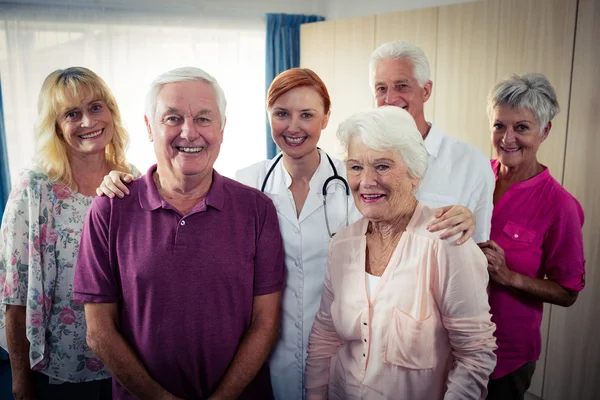 Group of pensioners with nurse — Stock Photo, Image