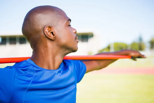 Athlete standing with javelin — Stock Photo, Image