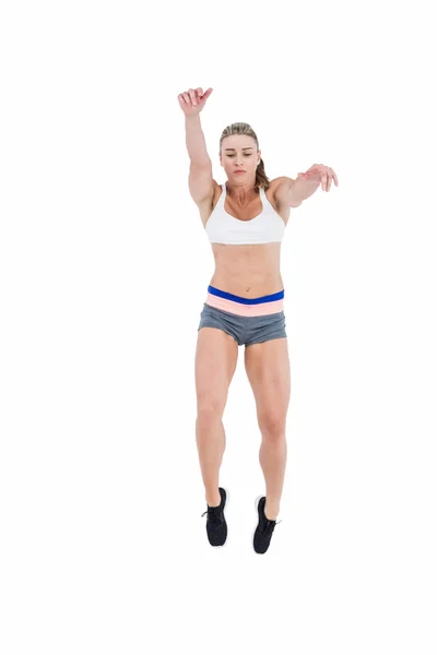 Female athlete jumping — Stock Photo, Image