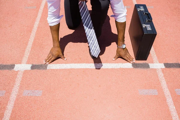 Businessman with briefcase ready to run — Stock Photo, Image