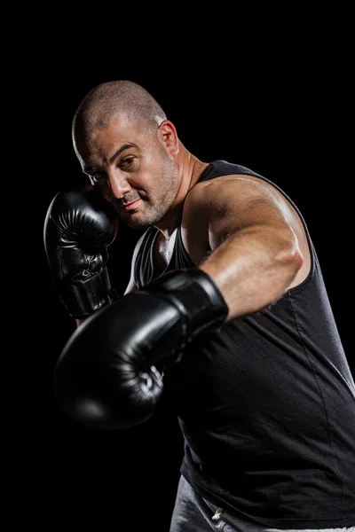 Boxer executando um gancho direito — Fotografia de Stock