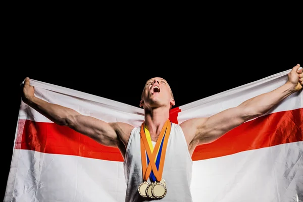 Atleta posando com medalhas de ouro — Fotografia de Stock