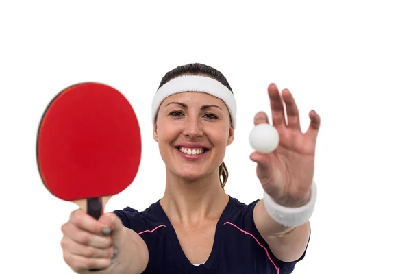 Atleta femenina sosteniendo paleta y pelota — Foto de Stock