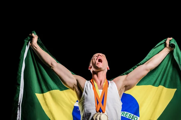 Athlete posing with gold medals — Stock Photo, Image