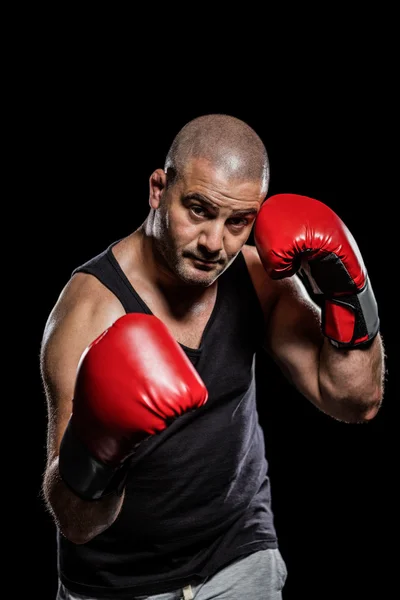 Boxer performing uppercut — Stock Photo, Image