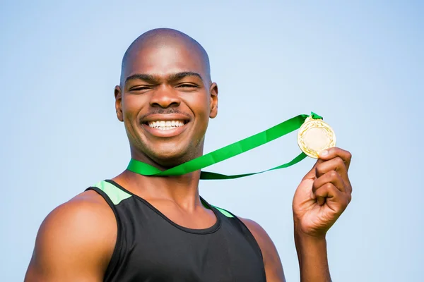 Athlete showing his gold medal — Stock Photo, Image