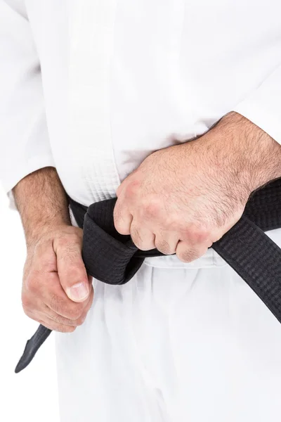 Fighter tightening karate belt — Stock Photo, Image