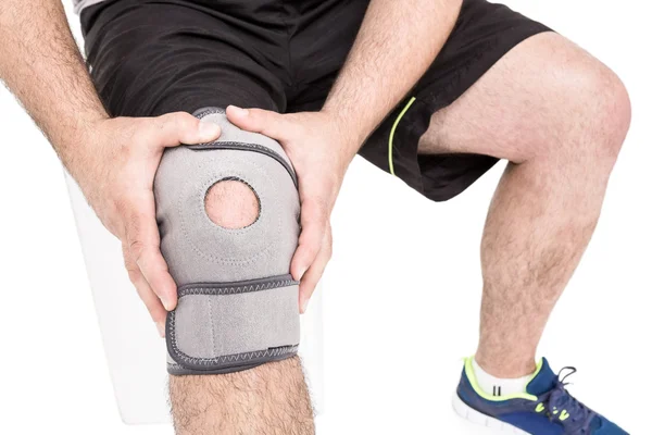 Athlete wearing knee pad — Stock Photo, Image