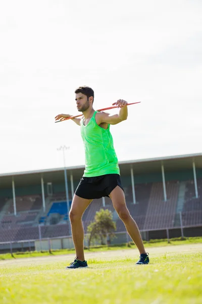 Atleta de pie con jabalina —  Fotos de Stock