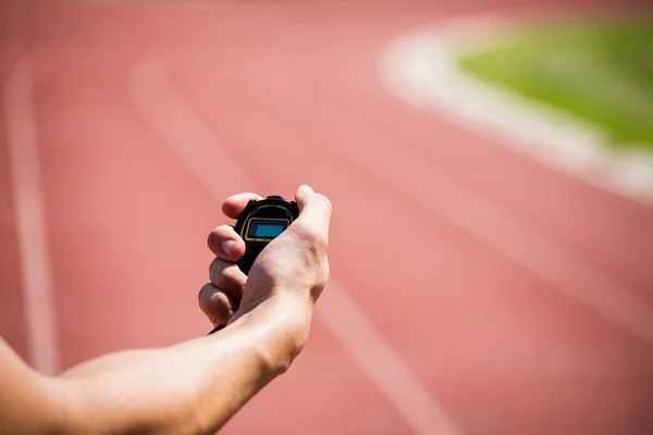 Hand bedrijf stopwatch — Stockfoto