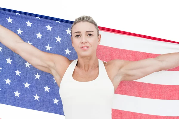Kvinnliga idrottare holding amerikanska flaggan — Stockfoto