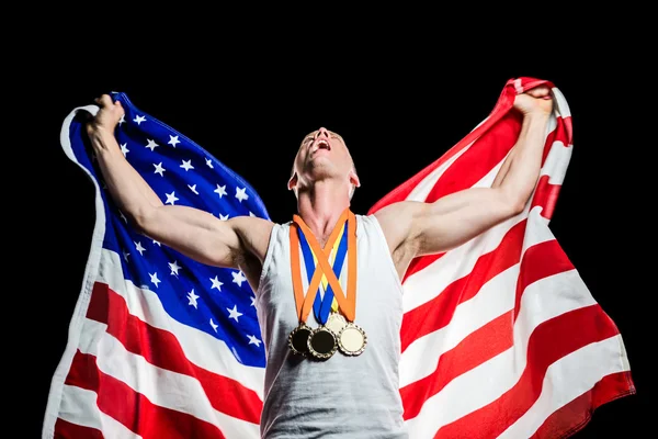 Athlete posing with gold medals — Stock Photo, Image