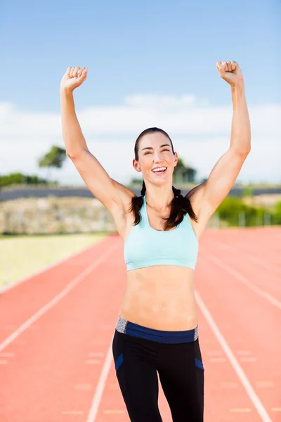 Female athlete posing after victory — Stock Photo, Image