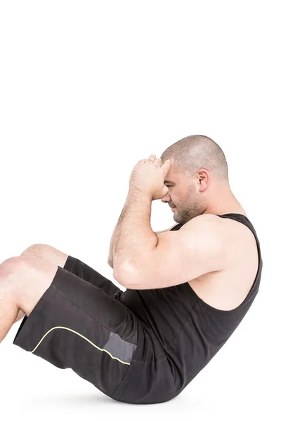 Atleta in abbigliamento sportivo facendo crunches — Foto Stock