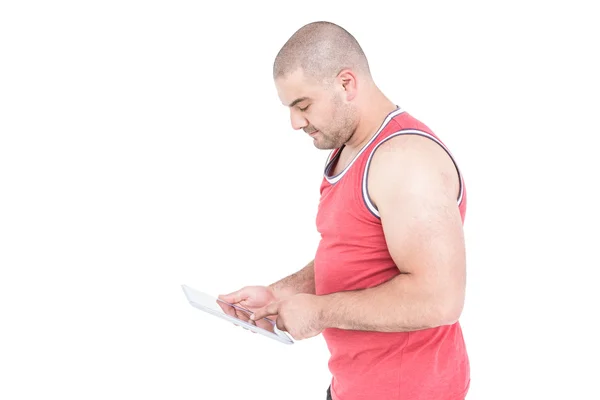 Athlete using digital tablet — Stock Photo, Image