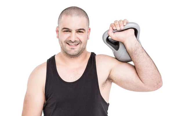 Fisiculturista levantando kettlebell pesado — Fotografia de Stock