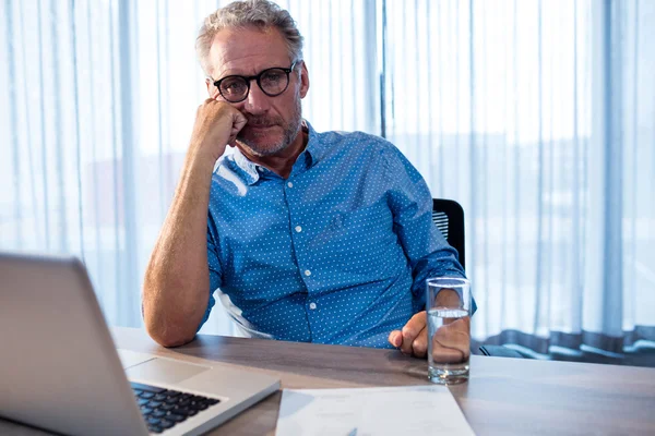 Concentrated businessman in office — Stock Photo, Image