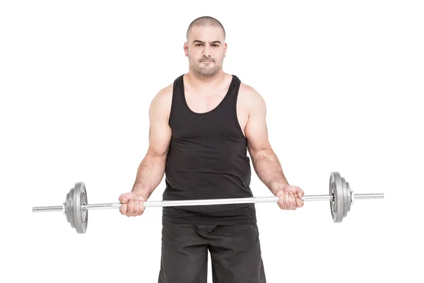 Bodybuilder lifting heavy barbell weights Royalty Free Stock Photos