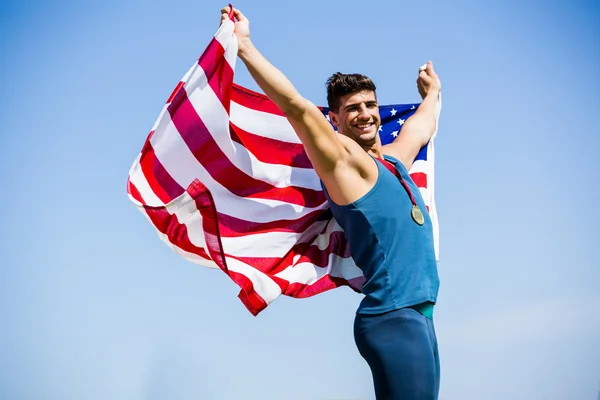 Athlète avec drapeau américain et médailles — Photo