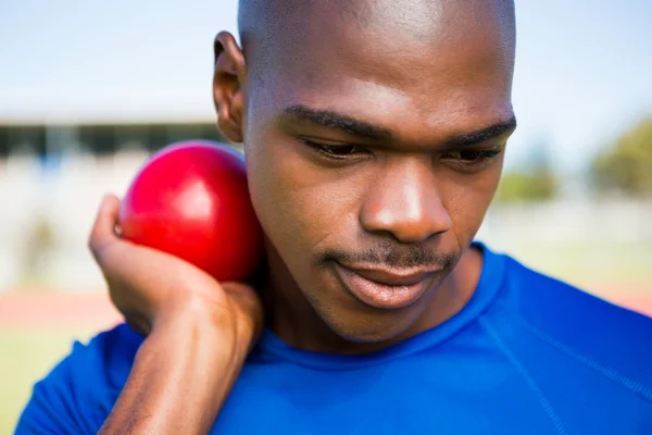 Athlete preparing to throw shot put ball — Stock Photo, Image