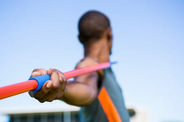 Athlete about to throw a javelin — Stock Photo, Image