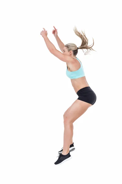 Female athlete jumping — Stock Photo, Image