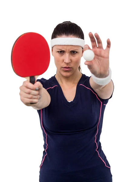 Atleta femenina sosteniendo paleta y pelota — Foto de Stock