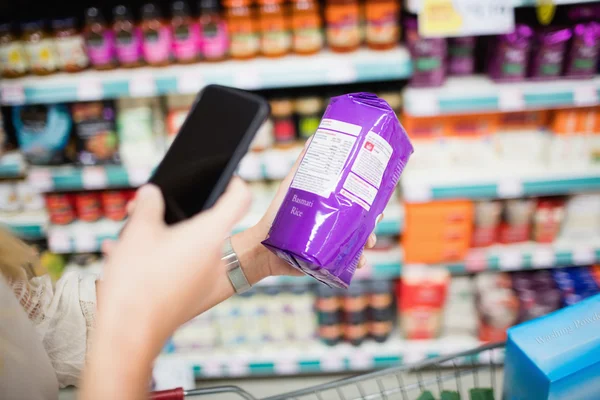 Hand photographing product with smartphone — Stock Photo, Image