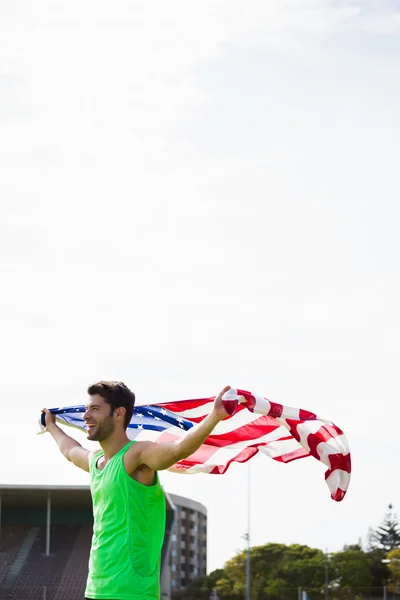 Amerikan bayrağıyla poz atlet — Stok fotoğraf