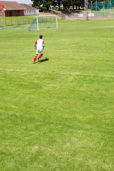 Football player practicing soccer — Stock Photo, Image