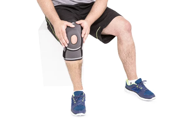 Athlete wearing knee pad — Stock Photo, Image