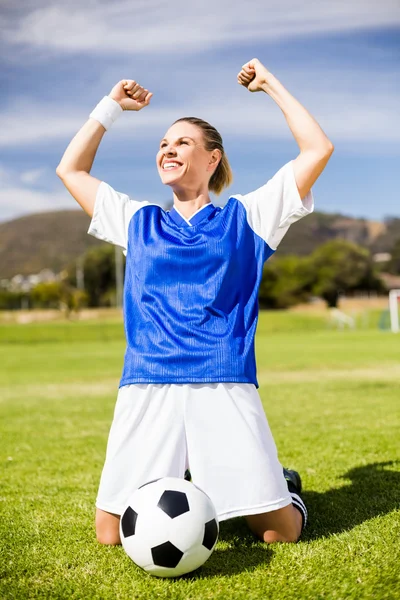 Excited football player in stadium — Stock Photo, Image