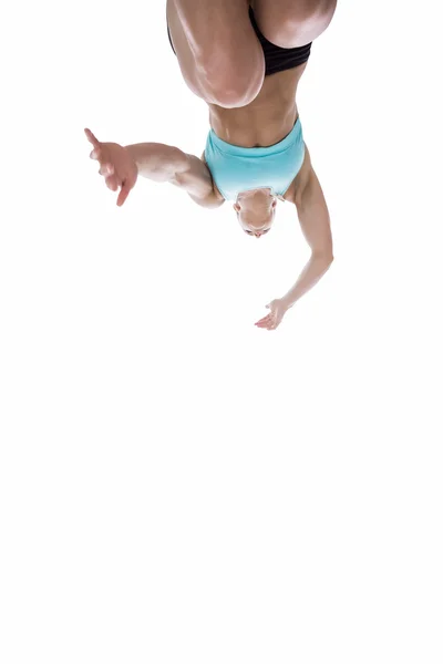 Low angle female athlete jumping — Stock Photo, Image