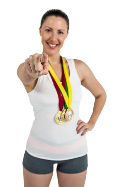 Female athlete with gold medals — Stock Photo, Image