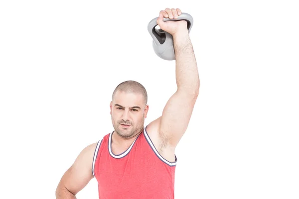 Bodybuilder lifting heavy kettlebell Royalty Free Stock Photos