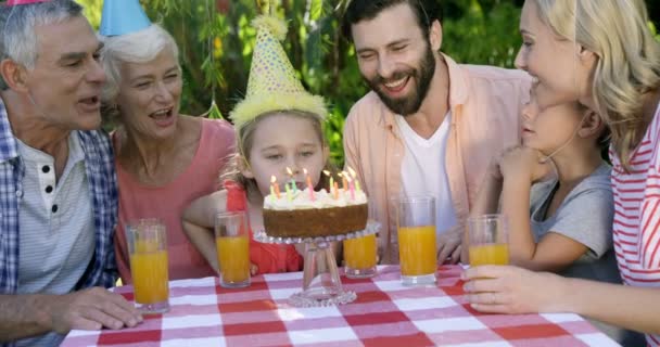 Little girl blowing out the candles — Stock Video