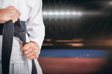 fighter tightening karate belt clipart