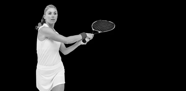 Idrettsutøver som spiller tennis med en racket – stockfoto
