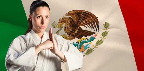 Female fighter performing hand salute — Stock Photo, Image