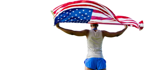 Deportista sosteniendo bandera americana —  Fotos de Stock