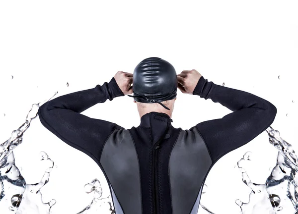 Swimmer in wetsuit wearing swimming goggles — Stock Photo, Image